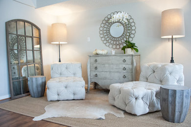 Home studio - mid-sized modern freestanding desk medium tone wood floor home studio idea in Houston with gray walls