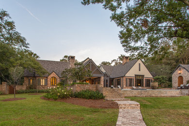 Eclectic two-story brick house exterior photo in Other
