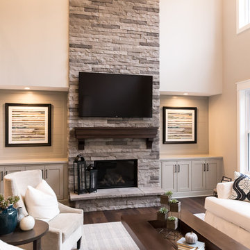 Living Room Remodel Featuring a Ledgestone Fireplace + Cabinetry + Shaw Coretec