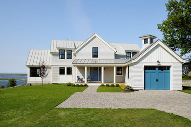 Mid-sized beach style white mixed siding and shingle exterior home photo in Boston with a metal roof and a gray roof