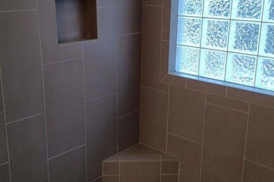 Inspiration for a gray tile and porcelain tile porcelain tile bathroom remodel in Miami