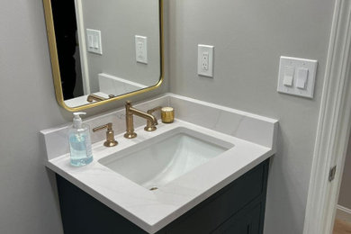 Example of a transitional powder room design in Boston