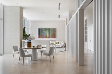 Living room - huge contemporary limestone floor living room idea in Miami with a tv stand