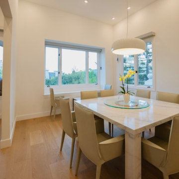Dining Room With Corner Windows and Bench