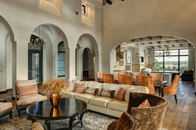 Living room - large traditional formal and open concept medium tone wood floor living room idea in Austin with beige walls and no tv
