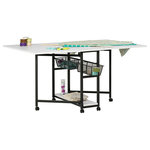 Studio Designs - Mobile Fabric Cutting Multipurpose Table with Folding Top and Storage - The latest addition to the Sew Ready Collection is the Mobile Fabric Cutting Table with Storage. It has 2 large work surfaces that fold down easily to create extra space in your sewing or hobby room when not in use. The casters allow you to move it to the perfect spot. These casters also lock to create a stable surface for cutting or arranging your fabric or paper. When fully extended this table offers a work surface that is 60 Inches wide and 36 inches deep. This large tabletop allows you to use a cutting mat or you can spread-out, cut or adjust fabric and patterns on the durable laminate surface.  Two wire mesh drawers and a bottom shelf run the full depth of the table, so your sewing or craft supplies are close.