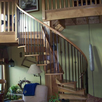 Spiral stair to family room catwalk