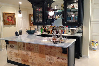 Example of a mid-sized classic u-shaped porcelain tile and beige floor seated home bar design in DC Metro with glass-front cabinets, black cabinets, mirror backsplash and gray countertops