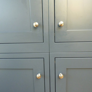 In-frame, ash painted kitchen 'Charcoal' & 'Ivory', with leather effect granite