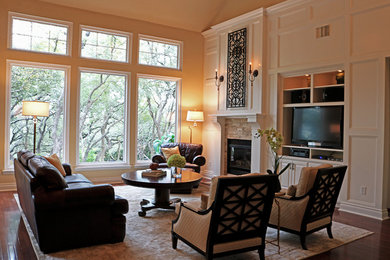 Mid-sized elegant formal and loft-style dark wood floor and red floor living room photo in Austin with white walls, a standard fireplace, a stone fireplace and a media wall