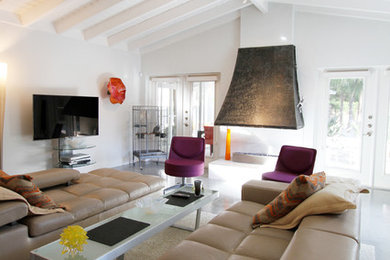 Example of a large 1950s open concept concrete floor and gray floor family room design in Tampa with white walls, a two-sided fireplace and a wall-mounted tv