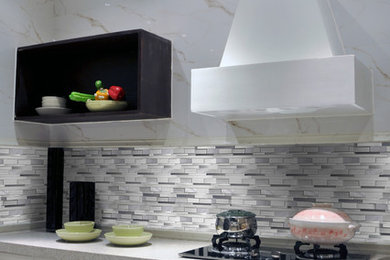 Inspiration for a mid-sized contemporary kitchen remodel in Los Angeles with raised-panel cabinets, white cabinets, gray backsplash and matchstick tile backsplash