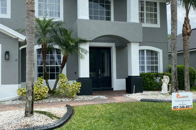 Contemporary gray two-story house exterior idea in Orlando