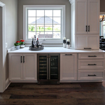 White Transitional Kitchen with Black Hardware and Glass Tile Backsplash