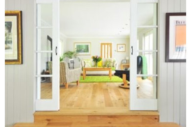 Example of a transitional living room design in Denver