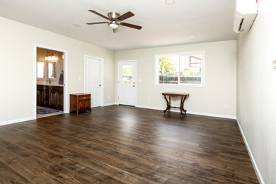 Bedroom - large traditional loft-style laminate floor bedroom idea in Denver