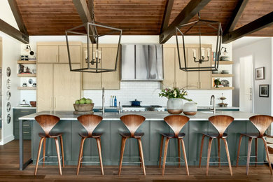 Mountain style kitchen photo in Denver with an island