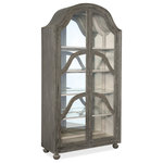 Hooker Furniture - Alfresco Costa Display Cabinet - Create a functional focal point of casual opulence with the arched-top Costa Display Cabinet that is grand, yet charming and approachable. Finished in a rich and earthy Pottery, or dark gray, color, the Costa Cabinet sparkles with a touch of glam, featuring an antique glass back panel and teardrop pendant hardware with dogwood flower backplates in hand-hammered Florentine gold. Behind the two wood-framed glass doors are four adjustable wood-framed glass shelves, and each shelf has one plate grove. A touch-switch light is on top of the right hinge.