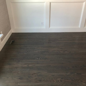 Red oak - 2 1/4" stained with custom grey stain and finished with waterbase