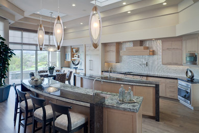 Open concept kitchen - huge modern medium tone wood floor open concept kitchen idea in San Francisco with beaded inset cabinets, light wood cabinets, two islands, a double-bowl sink, marble countertops, metallic backsplash, metal backsplash and stainless steel appliances
