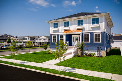 Example of a beach style home design design in Philadelphia