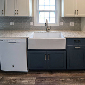 Two-Tone White & Blue Kitchen with Smoke Stained Quartz Countertops