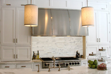 Inspiration for a large transitional u-shaped linoleum floor eat-in kitchen remodel in New York with a farmhouse sink, flat-panel cabinets, white cabinets, marble countertops, white backsplash, matchstick tile backsplash, stainless steel appliances and an island