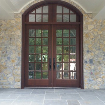 Custom front entry door unit with arched transom