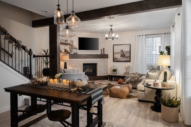Example of a mid-sized farmhouse open concept living room design in Austin with a corner fireplace, a tile fireplace and a media wall
