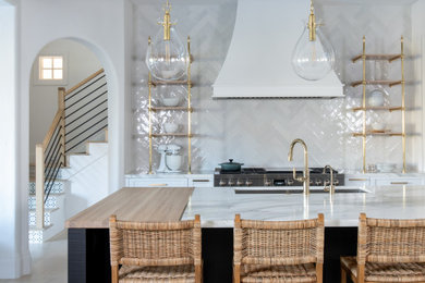 Inspiration for a transitional kitchen remodel in Dallas with marble countertops, white backsplash, an island and white countertops