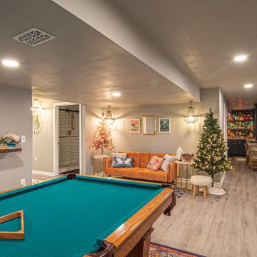 Basement Utilizing Open Space to Shoot Pool and Watch Favorite Sports Team