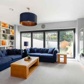 LUXURY FULLY FITTED LIVING ROOM WITH BESPOKE BOOKCASES AND MEDIA WALL