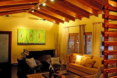 Inspiration for a mid-sized contemporary open concept dark wood floor and black floor living room remodel in Miami with a music area, beige walls, a wood stove, a plaster fireplace and no tv