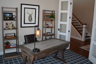 Mid-sized transitional freestanding desk carpeted study room photo in Other with beige walls