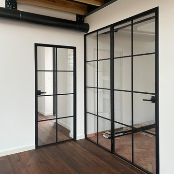 Steel doors in an industrial-style apartment