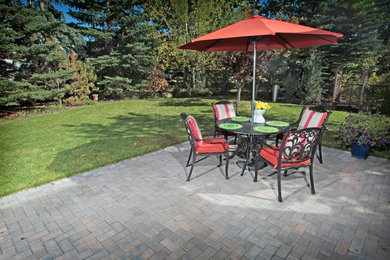 Traditional patio in Calgary with brick pavers.