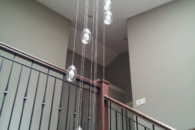 Staircase - huge modern wooden staircase idea in Vancouver