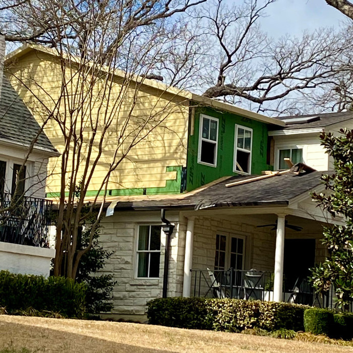 Full second story addition in the Dallas neighborhood of Lakewood 75214, including large media room, remodeled bathroom, remodeled laundry room.  Concrete horizontal lap siding, gabled roof structure,