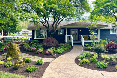 Design ideas for a mid-sized partial sun front yard stone landscaping in Seattle for spring.