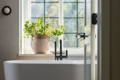 Inspiration for a modern master single-sink bathroom remodel with a hinged shower door