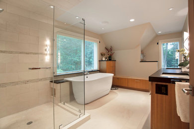 Inspiration for a mid-sized contemporary master beige tile and porcelain tile porcelain tile bathroom remodel in Boston with an undermount sink, flat-panel cabinets, medium tone wood cabinets, beige walls and solid surface countertops