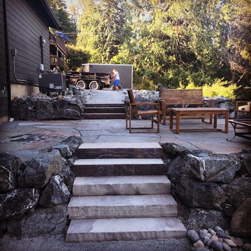 Terraced pathways, stone patio, and creek bed