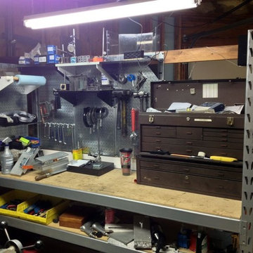 Pegboard workstation and tool storage area created out of some old pallet rack s