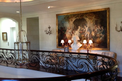 Foyer - huge traditional foyer idea in Other with beige walls