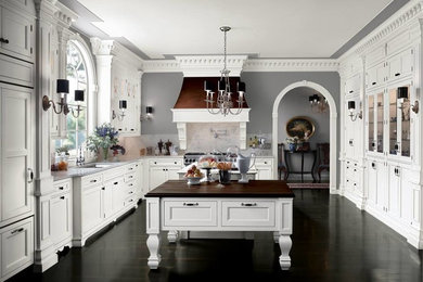 Large transitional u-shaped dark wood floor enclosed kitchen photo in Houston with a double-bowl sink, recessed-panel cabinets, white cabinets, stainless steel appliances, two islands and gray backsplash