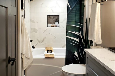 Example of a mid-sized trendy kids' multicolored tile and porcelain tile brown floor and light wood floor bathroom design in Seattle with shaker cabinets, gray cabinets, a two-piece toilet, gray walls, an undermount sink, quartz countertops and white countertops