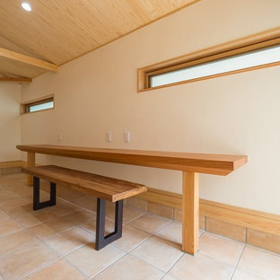 Modern study in Other with travertine flooring, no fireplace and orange floors.