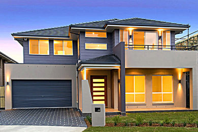 Design ideas for a large modern two-storey brick beige exterior in Sydney.