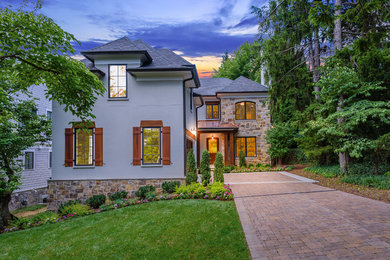 Inspiration for a large transitional beige three-story mixed siding house exterior remodel in DC Metro with a hip roof and a mixed material roof