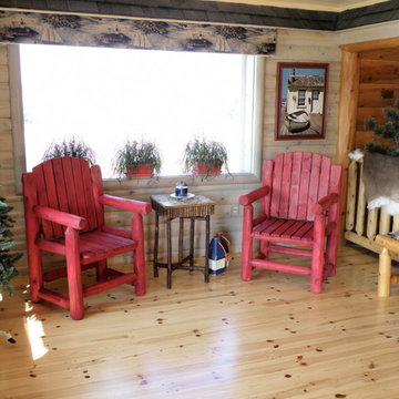 Knotty pine natural flooring and quarter log walls